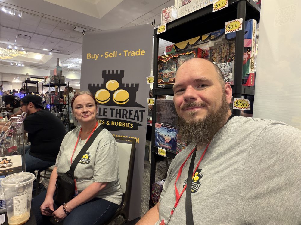 Jeremy and Starr of Triple Threat Games & Hobbies at their card show booth.