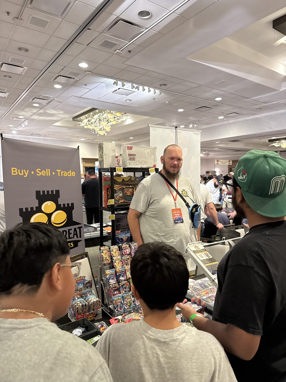 Jeremy talking with customers at the Triple Threat Games & Hobbies booth.